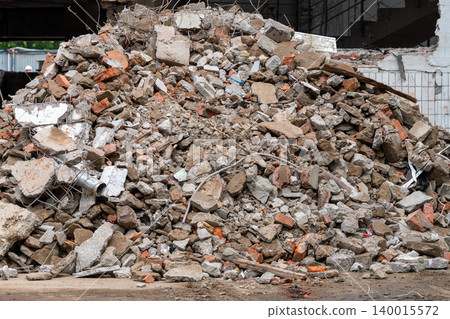 Pile of Demolition Rubble and Concrete Debris at Urban Construction Site After Building Collapse Pile of Demolition Rubble and Concrete Debris at Urban Construction Site After Building Collapse 140015572