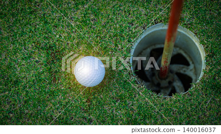 Golf balls on a green lawn in a beautiful golf course with morning sunshine. Golf balls on a green lawn in a beautiful golf course with morning sunshine. 140016037