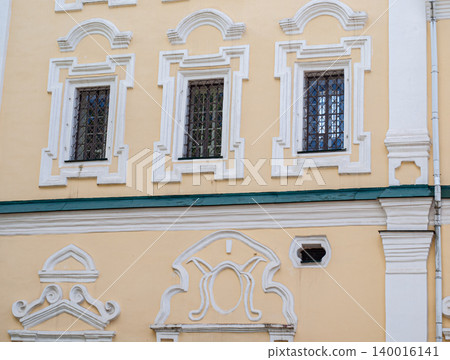 Architectural detail of a window and baroque wall decor on a church in Smolensk. 140016141