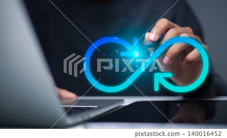 Businessman Hand using Stylus with Glowing Infinity Loop Arrow Interface on Laptop Businessman Hand using Stylus with Glowing Infinity Loop Arrow Interface on Laptop 140016452