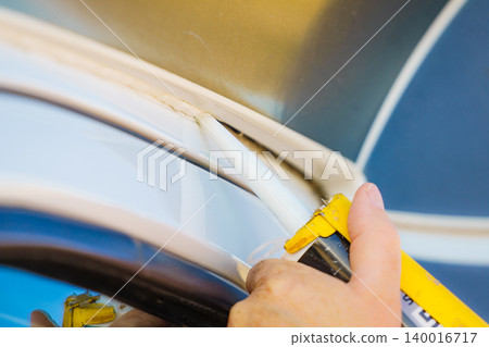 Applying silicon on caravan body Applying silicon on caravan body 140016717