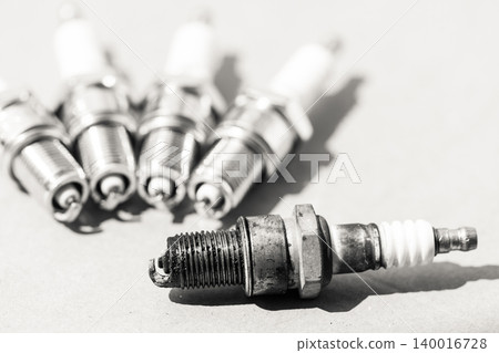 Auto service. Set of spark plugs as spare part of car. 140016728