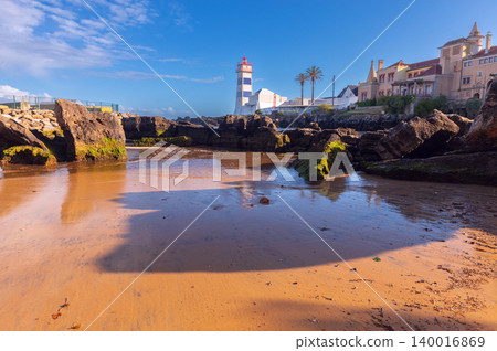 Santa Marta lighthouse and rocky Atlantic shoreline in Cascais Portugal Santa Marta lighthouse and rocky Atlantic shoreline in Cascais Portugal 140016869