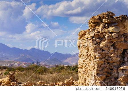 Ruined building, destroyed house with mountains view in the distance Ruined building, destroyed house with mountains view in the distance 140017056