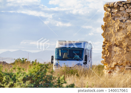 Camper vehicle camping in coastal landscape in Spain 140017061