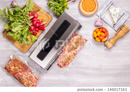 Vacuum sealing meat preparing for sous vide cooking 140017163