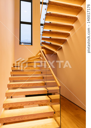 Wooden staircase with minimalist interior architecture and warm light Wooden staircase with minimalist interior architecture and warm light 140017176