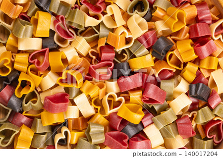 Colorful heart shaped pasta symbolizing love and cooking Colorful heart shaped pasta symbolizing love and cooking 140017204