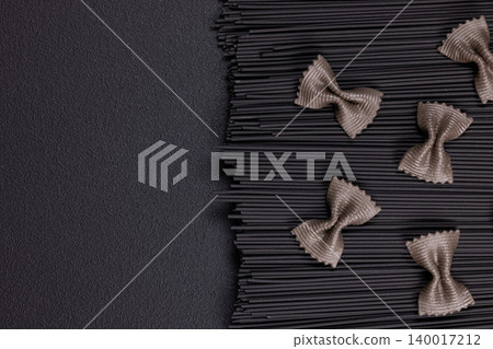Black pasta spaghetti with brown farfalle bow tie pasta 140017212