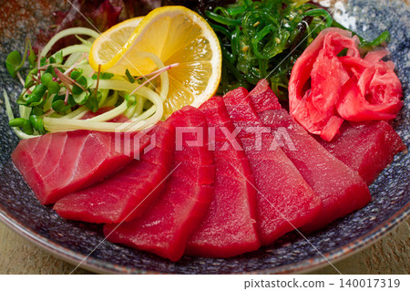 tuna sashimi with daikon and wakame salad, pickled ginger, in a bowl, tuna sashimi with daikon and wakame salad, pickled ginger, in a bowl, 140017319