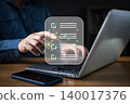 A person interacting with a digital checklist on a laptop, symbolizing task management, productivity, workflow organization, and efficient planning in modern digital work environments. 140017376