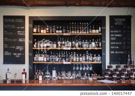 Whisky bottles displayed on a shelf Whisky bottles displayed on a shelf 140017447