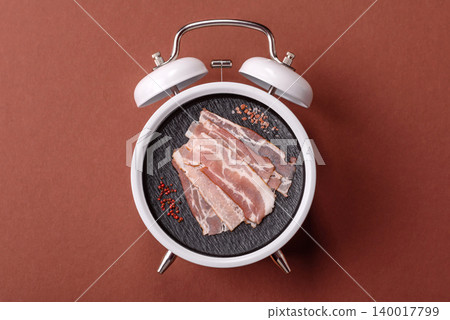 Raw fresh bacon slices with layers of meat or prosciutto with salt and spices. Raw bacon Raw fresh bacon slices with layers of meat or prosciutto with salt and spices. Raw bacon 140017799
