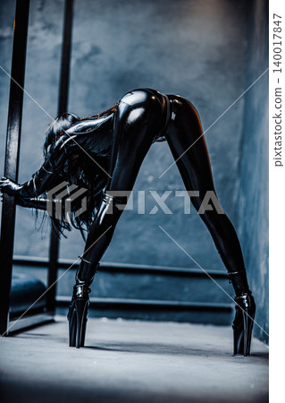 Bdsm style woman in black latex sexy posing 140017847