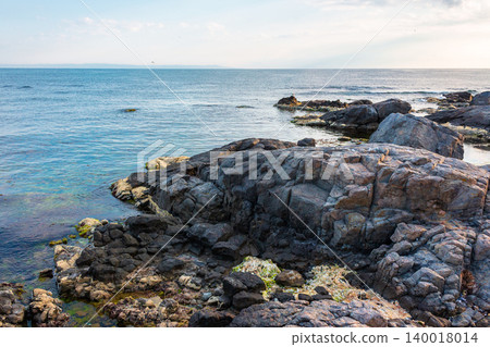 sea coast with stones and rocks. summer vacation background. seascape in the morning light. relaxing at the sea. coast of bulgaria sea coast with stones and rocks. summer vacation background. seascape in the morning light. relaxing at the sea. coast of bulgaria 140018014