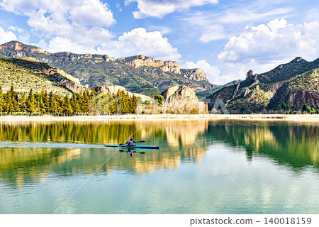 Man kayaking on the reservoir in the Sant Llorenc de Montgai Natural Park, Noguera region, Lleida, Catalonia. Nature, water sports 140018159