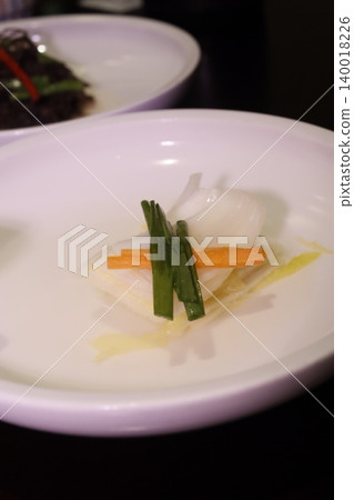 Elegant Fish Dish with Garnish on White Plate Elegant Fish Dish with Garnish on White Plate 140018226