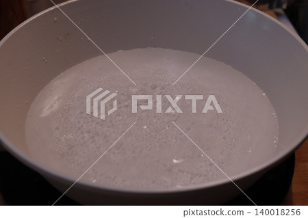 Frothy Liquid in Cooking Pot Frothy Liquid in Cooking Pot 140018256