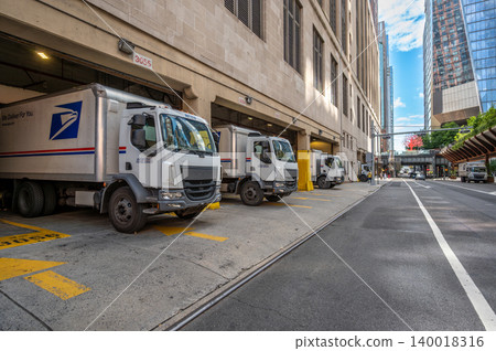 New york, usa august 20,2024. Usps mail trucks parked at a loading dock in an urban setting, representing postal service and logistics in new york city New york, usa august 20,2024. Usps mail trucks parked at a loading dock in an urban setting, representing postal service and logistics in new york city 140018316