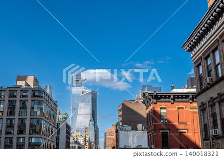 New york, usa august 20,2024. Hudson yards skyline with modern skyscrapers and classic buildings climbing into a bright blue sky, featuring the edge deck New york, usa august 20,2024. Hudson yards skyline with modern skyscrapers and classic buildings climbing into a bright blue sky, featuring the edge deck 140018321