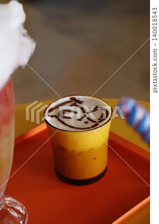 Latte Art in Yellow Cup Latte Art in Yellow Cup 140018543