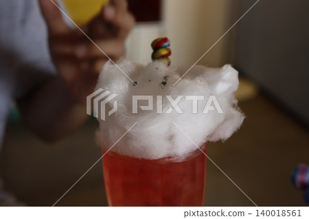 Cotton Candy Topped Cocktail with Colorful Candy Stick 140018561