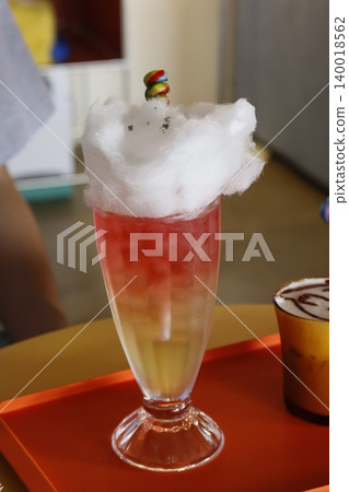 Cocktail with Cotton Candy and Candy Garnish 140018562