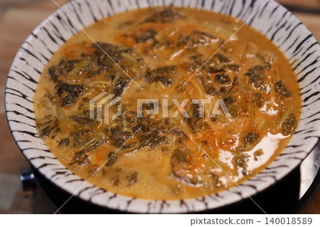 Steaming Vegetable Soup in Zebra-Print Bowl Steaming Vegetable Soup in Zebra-Print Bowl 140018589