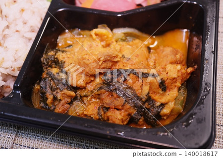 Spicy Curry with Rice in Black Container Spicy Curry with Rice in Black Container 140018617