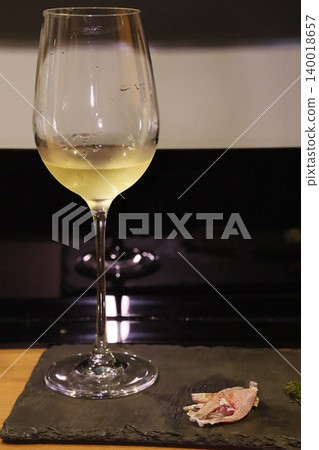 Wine Glass with White Wine and Slate Plate 140018657