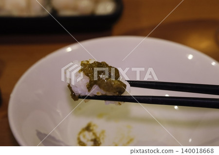 Rice with Green Sauce on Chopsticks Rice with Green Sauce on Chopsticks 140018668