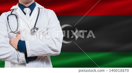 Male doctor with stethoscope on Libyan flag. Doctor holding stethoscope on Libya flag 140018870