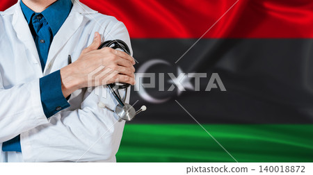 Doctor with stethoscope on Libya flag. Doctor holding stethoscope on Libya flag 140018872