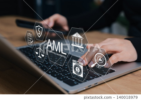 AML Anti-Money Laundering concept. business person typing on laptop interacting with digital icons of financial law, fraud protection, compliance, regulations, transaction screening, crime prevention, 140018979