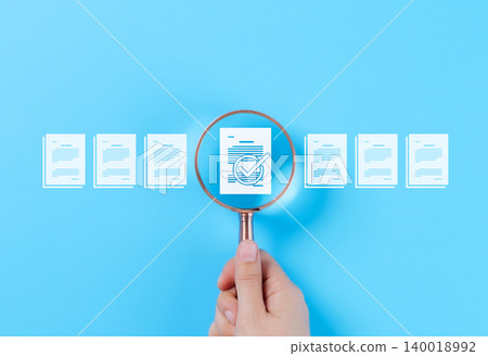 Document Review and Quality Control Process Concept. A hand holding a magnifying glass focuses on a document with a checkmark, document review, and approval processes. Certificate management, Audit, Document Review and Quality Control Process Concept. A hand holding a magnifying glass focuses on a document with a checkmark, document review, and approval processes. Certificate management, Audit, 140018992