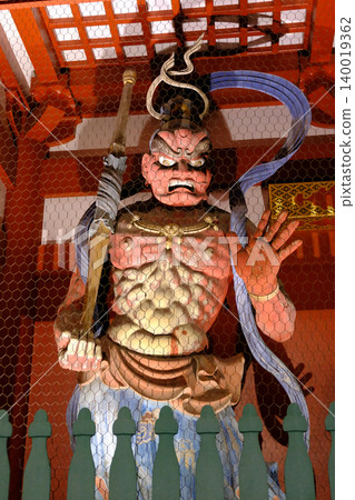 The Kongo Rikishi statue (Agyo) at the Hozomon Gate of Senso-ji Temple, illuminated at night. The Kongo Rikishi statue (Agyo) at the Hozomon Gate of Senso-ji Temple, illuminated at night. 140019362