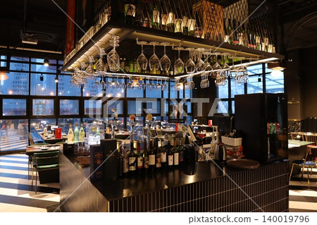 Modern Urban Bar Interior with Glassware and Bottles Modern Urban Bar Interior with Glassware and Bottles 140019796
