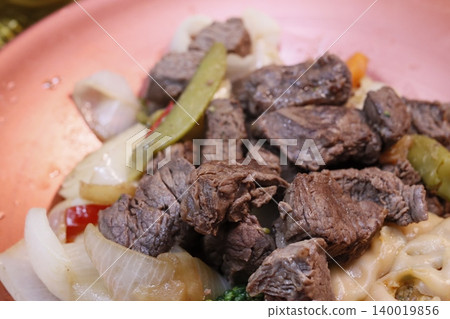 Grilled Beef with Onions and Peppers Grilled Beef with Onions and Peppers 140019856
