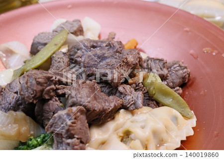 Beef and Vegetable Dish on Pink Plate 140019860