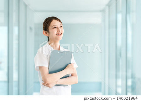 Young Asian women in scrubs who are doctors, nurses, caregivers, or emergency physicians. Young Asian women in scrubs who are doctors, nurses, caregivers, or emergency physicians. 140021964