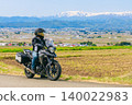A view of snow-capped Mt. Iide and a motorcycle from Koibitozaka (Lover's Hill). 140022983