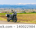 A view of snow-capped Mt. Iide and a motorcycle from Koibitozaka (Lover's Hill). 140022984