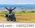 A view of snow-capped Mt. Iide and a motorcycle from Koibitozaka (Lover's Hill). 140022985