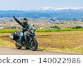 A view of snow-capped Mt. Iide and a motorcycle from Koibitozaka (Lover's Hill). 140022986