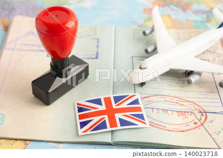 UK United Kingdom flag with passport and airplane for travel. UK United Kingdom flag with passport and airplane for travel. 140023718