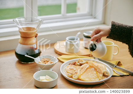 Homemade pancakes and coffee on the table Homemade pancakes and coffee on the table 140023899