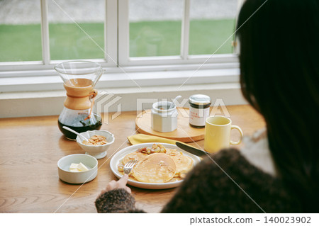 Homemade pancakes and coffee on the table Homemade pancakes and coffee on the table 140023902