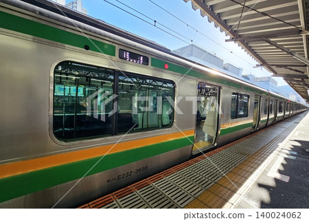 Japanese commuter train, identifiable as an E231 series at Kinomiya Station. Japanese commuter train, identifiable as an E231 series at Kinomiya Station. 140024062