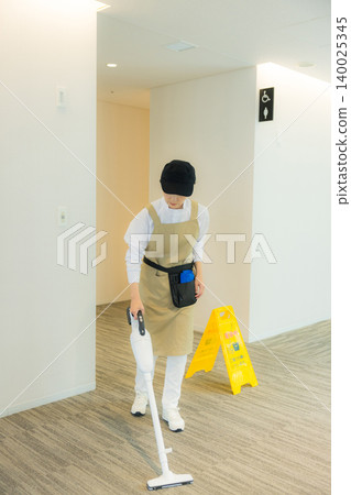 Middle-aged female cleaner Middle-aged female cleaner 140025345