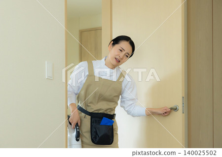 Middle-aged female cleaner Middle-aged female cleaner 140025502